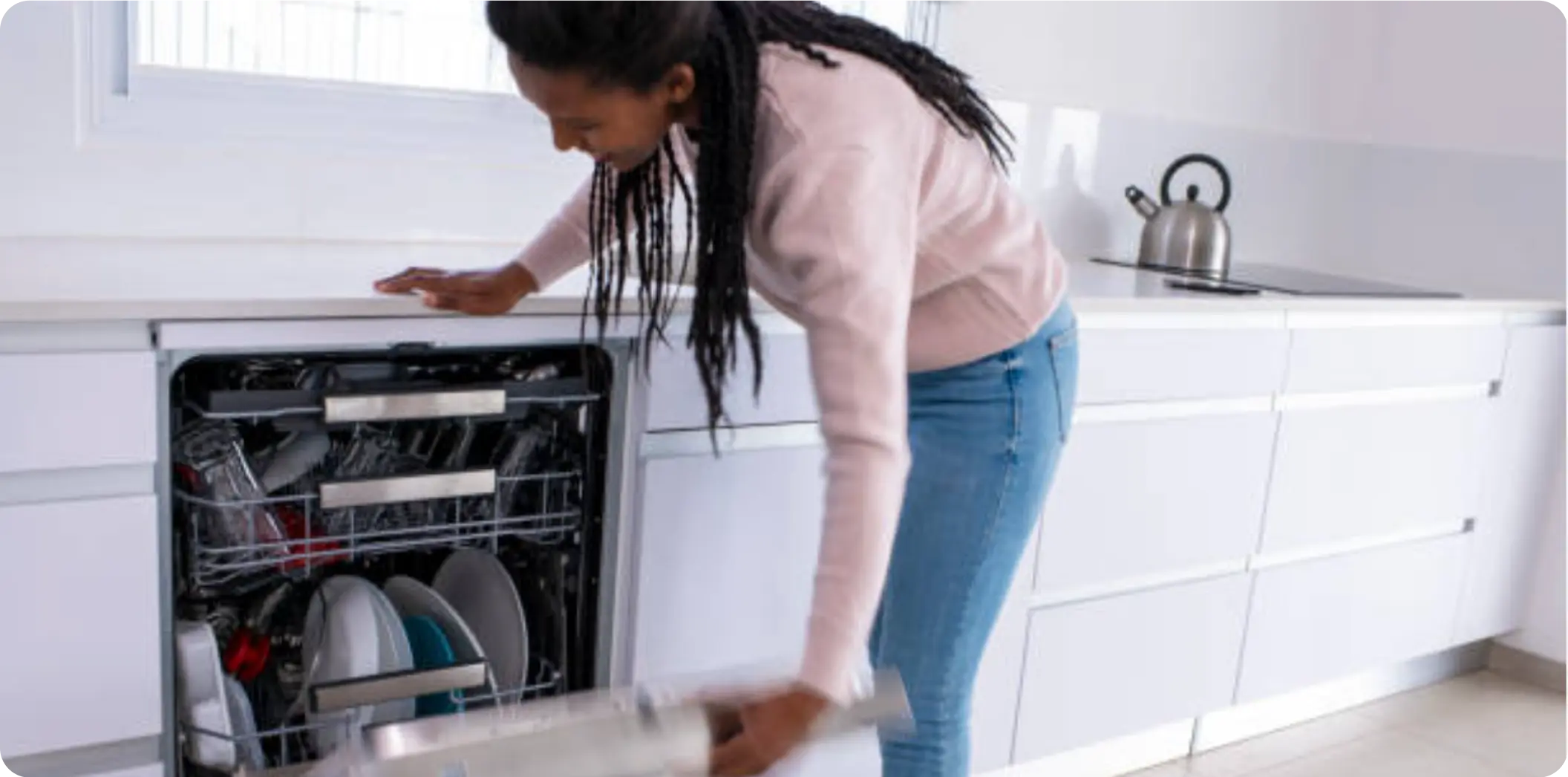 Testimonial from Charlie, affected by x-linked retinitis pigmentosa (XLRP) daily, pictured opening the dishwasher